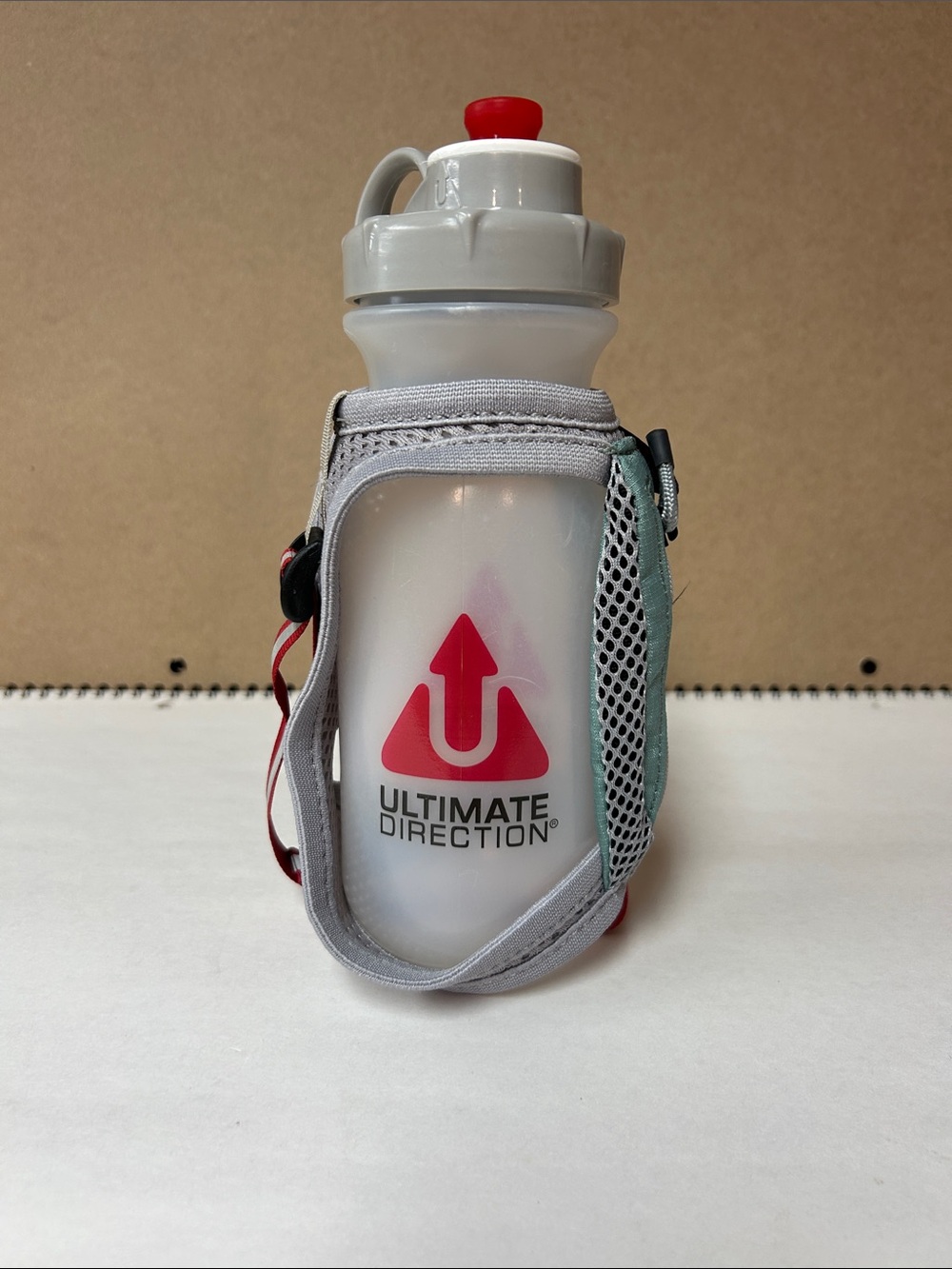 Ultimate Direction White & Red Hand Bottle with Adjustable Strap